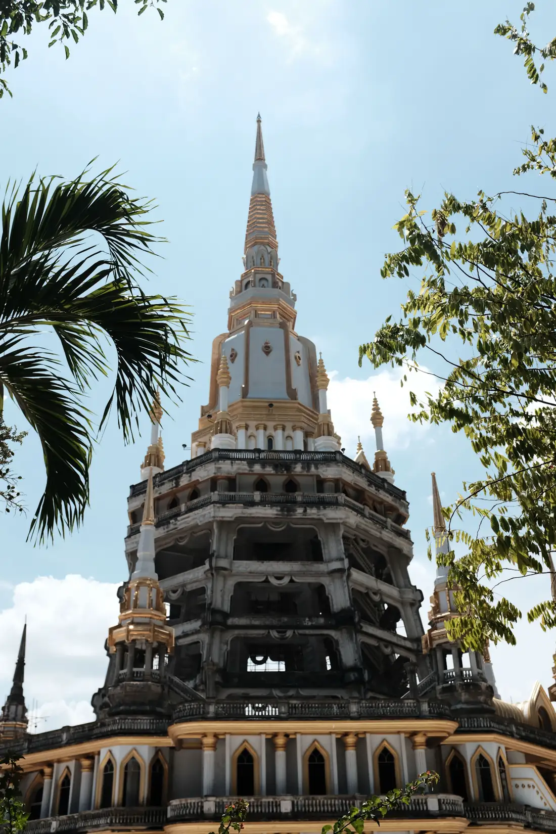 Thai temple spire with palms